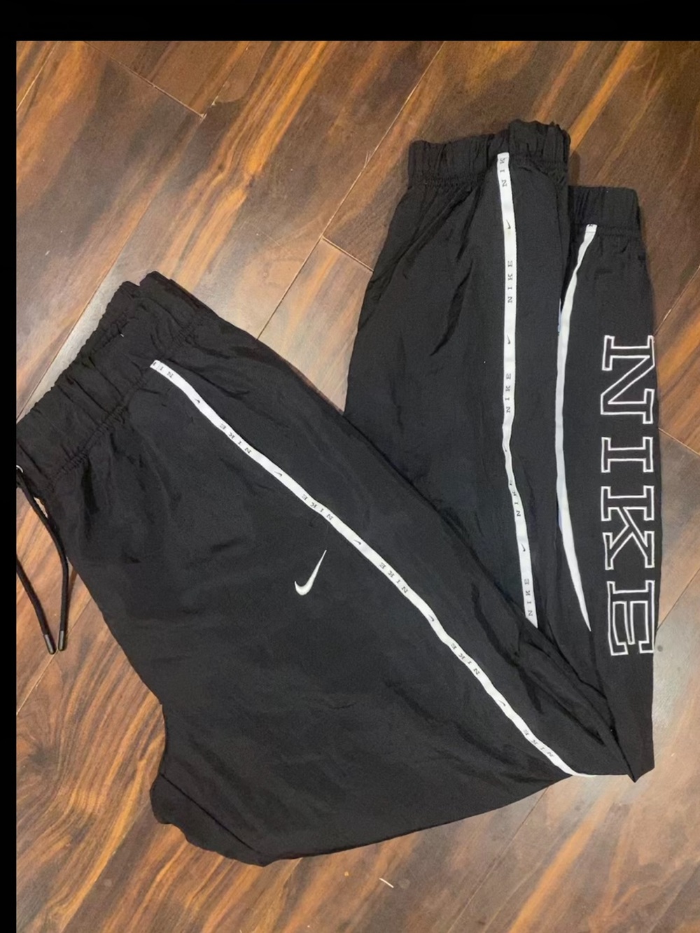 Nike Black Jogger Sweatpants with White Stripe and Stitched Logo